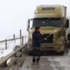 Illustration for article titled Trucker Freaks Out As Big Rigs Crash In Slow-Motion On An Icy Highway
